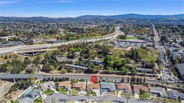 birds eye view of property featuring a mountain view