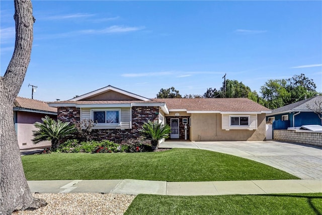 single story home with stucco siding and a front yard