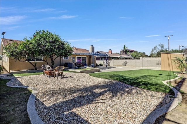 view of yard with fence and a patio