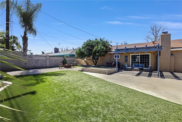 view of yard featuring a patio area, fence, and an outdoor living space