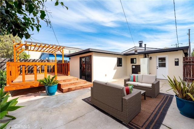 view of patio / terrace featuring fence, outdoor lounge area, a wooden deck, and a pergola