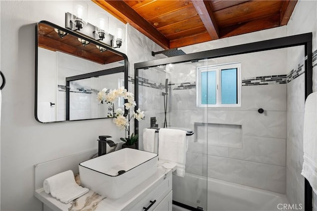 bathroom with bath / shower combo with glass door, beamed ceiling, vanity, and wood ceiling