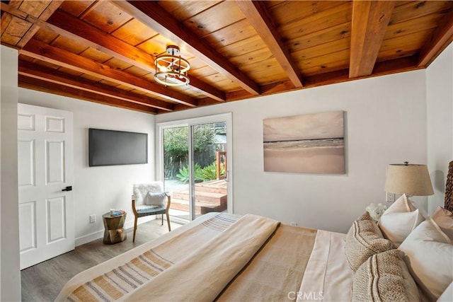 bedroom with access to outside, wooden ceiling, beam ceiling, and wood finished floors