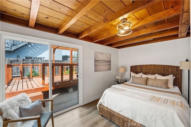 bedroom with access to exterior, beam ceiling, wood ceiling, wood finished floors, and baseboards