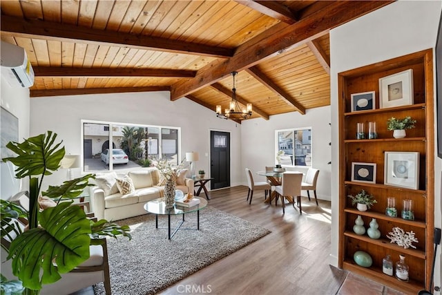 living area featuring lofted ceiling with beams, a wall mounted AC, wood ceiling, wood finished floors, and a chandelier