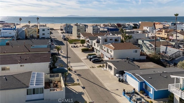 birds eye view of property with a water view and a residential view