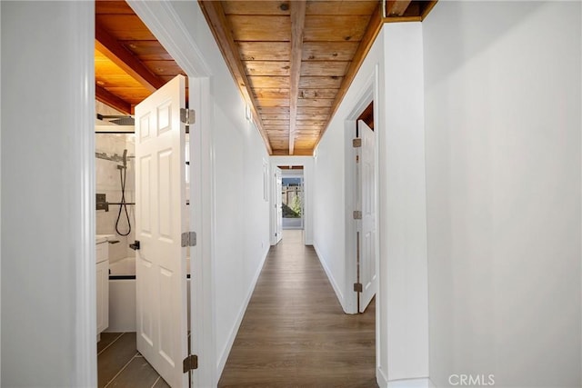 hallway with wood ceiling, dark wood finished floors, and baseboards