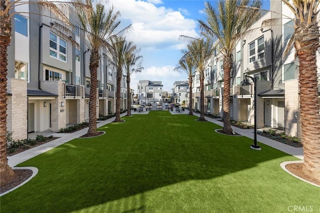 surrounding community featuring a residential view and a lawn