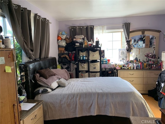 bedroom with wood finished floors