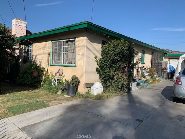 view of side of property with stucco siding