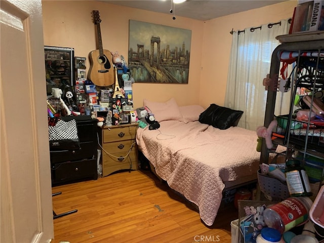 bedroom featuring wood finished floors