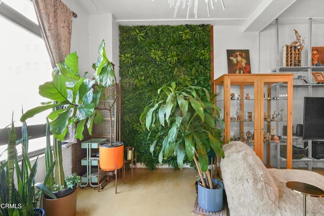 sitting room featuring concrete flooring