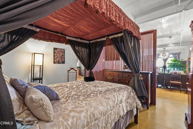 bedroom featuring finished concrete floors