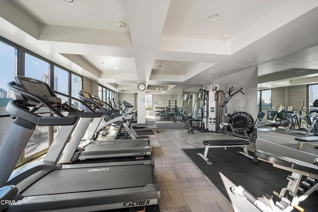 workout area featuring coffered ceiling