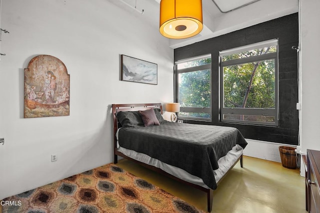 bedroom with concrete flooring