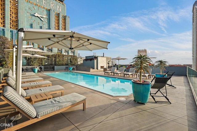 community pool featuring a patio area