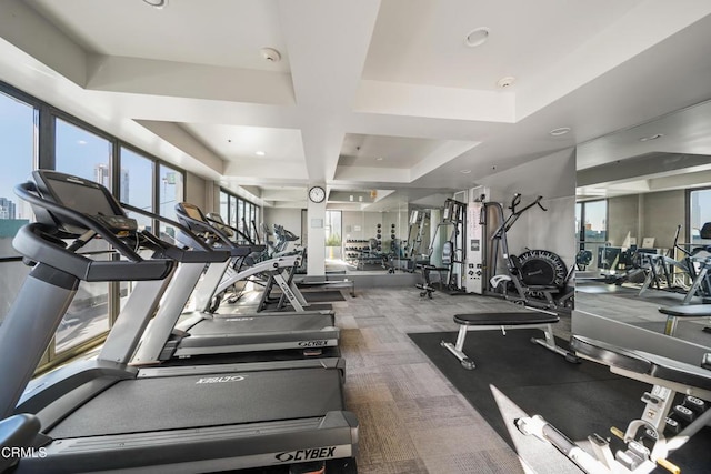exercise room featuring coffered ceiling