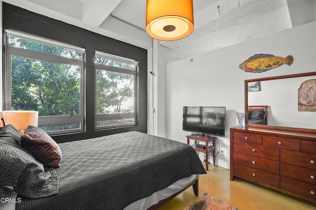 bedroom with beam ceiling