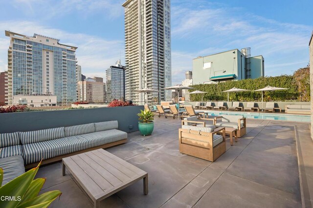 849 S Broadway Unit M11, Los Angeles, CA 90014 - view of patio featuring an outdoor hangout area, a community pool, and a city view