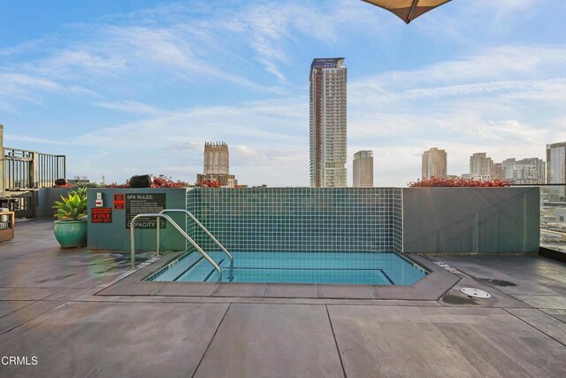 849 S Broadway Unit M11, Los Angeles, CA 90014 - view of pool with a tennis court and a skyline view