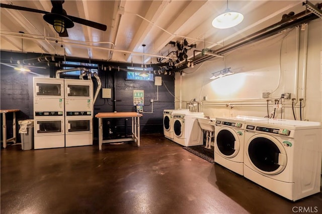 shared laundry area with a ceiling fan, stacked washer / dryer, and washing machine and clothes dryer