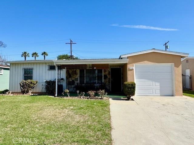 single story home with a garage, concrete driveway, a front lawn, and board and batten siding