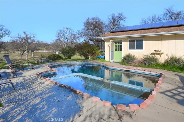 view of pool featuring a patio area and a pool with connected hot tub