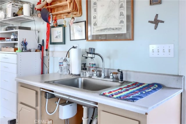 kitchen with light countertops and a sink