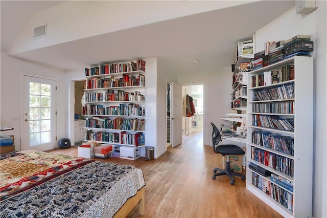 bedroom featuring visible vents and wood finished floors