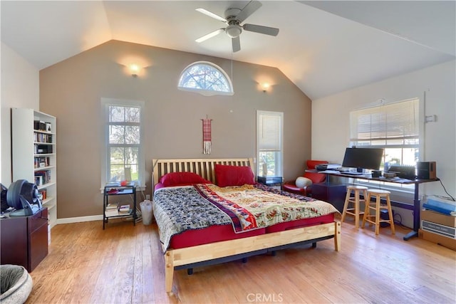 bedroom featuring lofted ceiling, wood-type flooring, baseboards, and ceiling fan