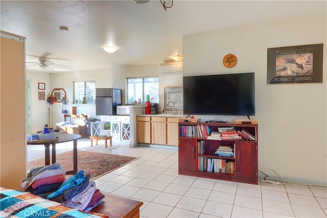 living room featuring light tile patterned floors and ceiling fan