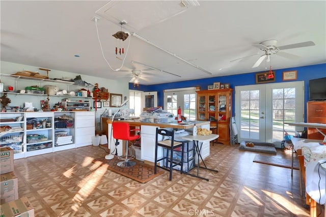 kitchen with a ceiling fan and french doors