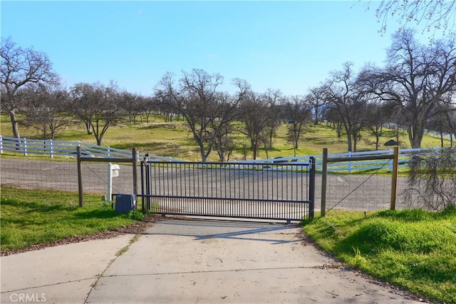 view of gate with fence