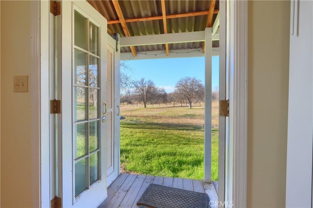 doorway to outside with wood-type flooring