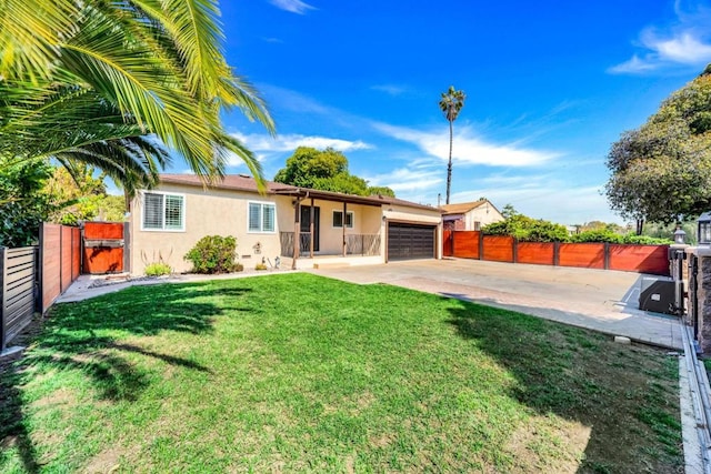 single story home with a front lawn, an attached garage, fence, and stucco siding