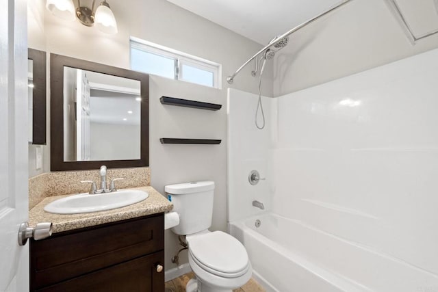 bathroom featuring toilet,  shower combination, and vanity