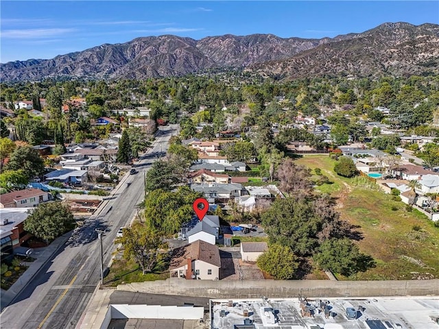 drone / aerial view featuring a residential view and a mountain view