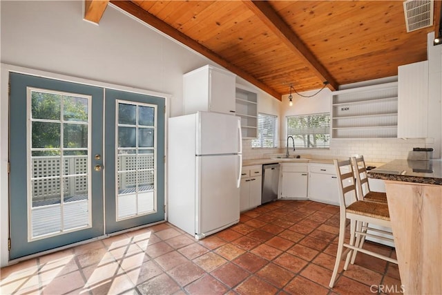 kitchen featuring backsplash, dishwasher, french doors, freestanding refrigerator, and open shelves