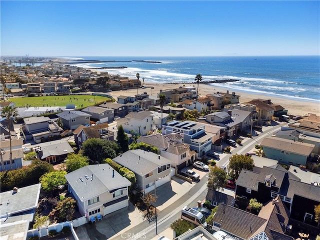 bird's eye view with a view of the beach, a water view, and a residential view