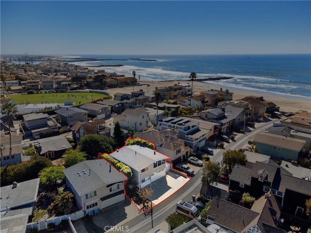 birds eye view of property with a residential view and a water view