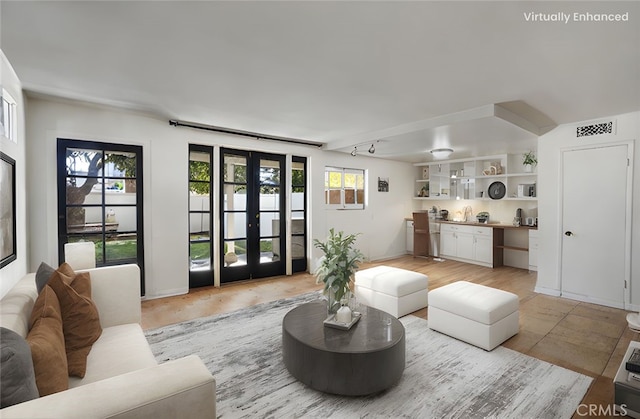 living room with visible vents and french doors