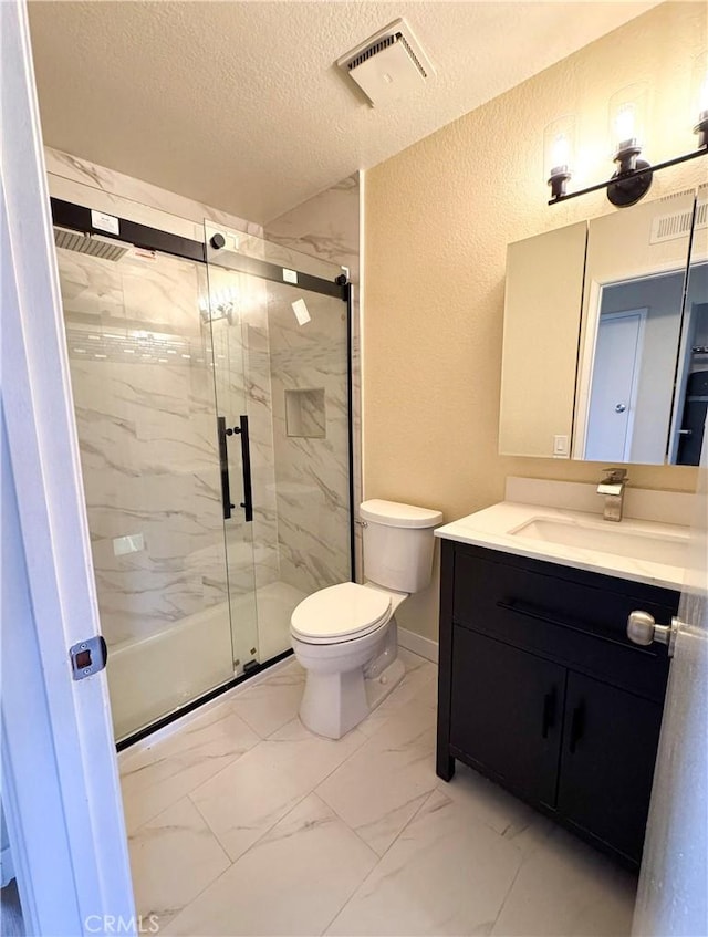 bathroom with a textured ceiling, a textured wall, toilet, visible vents, and marble finish floor