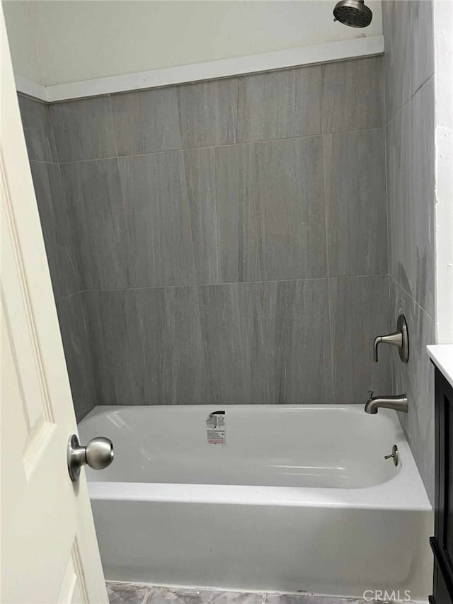 bathroom featuring shower / washtub combination and vanity