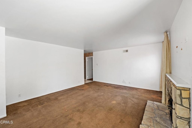 unfurnished living room featuring carpet floors and visible vents