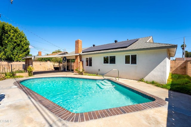 view of pool featuring a patio, a fenced backyard, and a fenced in pool