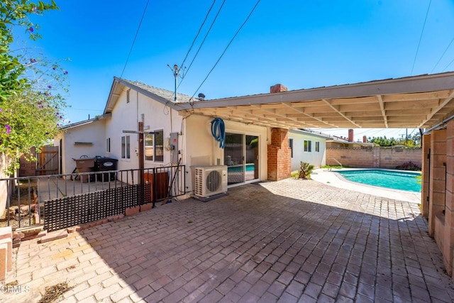 back of property featuring ac unit, a fenced backyard, a patio area, and stucco siding