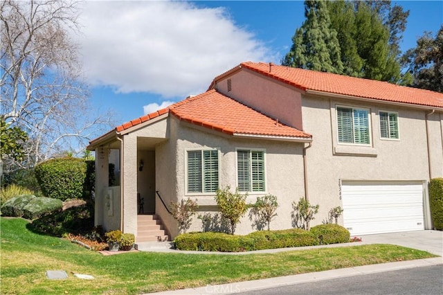 mediterranean / spanish-style house with concrete driveway, a tiled roof, an attached garage, a front lawn, and stucco siding