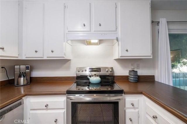 kitchen with under cabinet range hood, appliances with stainless steel finishes, and white cabinets