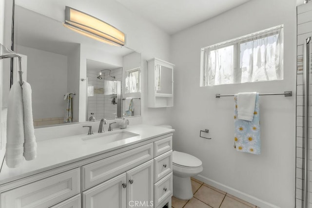 334 Gladys Ave Unit 103, Long Beach, CA 90814 - full bathroom with toilet, a stall shower, tile patterned flooring, baseboards, and vanity
