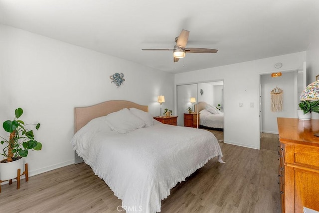 334 Gladys Ave Unit 103, Long Beach, CA 90814 - bedroom with a ceiling fan, light wood-style flooring, baseboards, and a closet